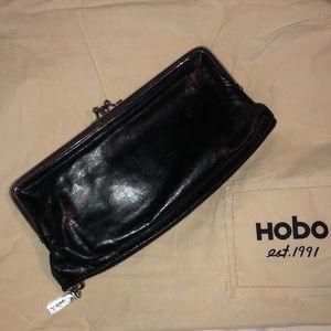 HOBO black leather clutch. Lots of compartments.